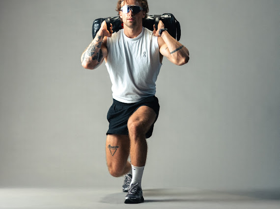 Weighted lunge with sandbag
